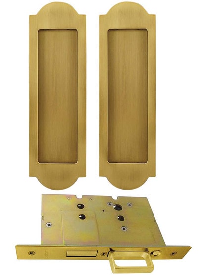 Premium Dummy Pocket-Door Mortise Lock Set with Arched Pulls in Aged Brass.